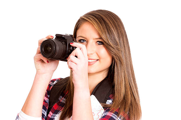 istock beautiful young girl with a camera 509546070