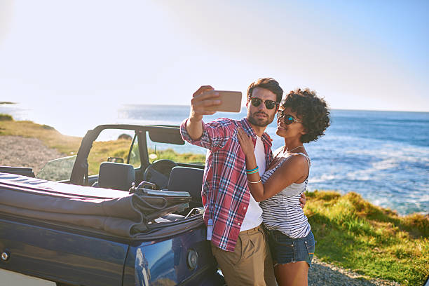 istock Young beautiful couple on roadtrip making selfie 509546108
