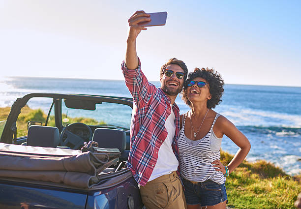 istock Young beautiful couple on roadtrip making selfie 509546538