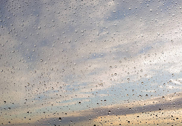 Photographed with mobile phone. Drops of rain on glass.