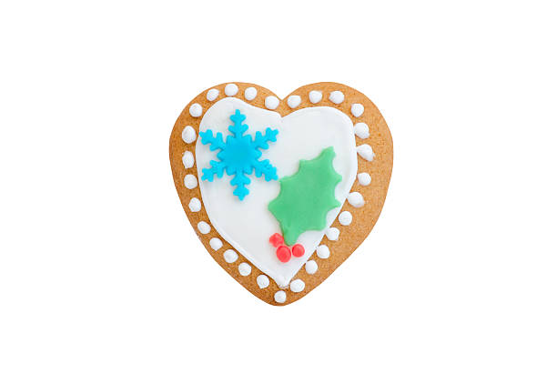 istock christmas gingerbread heart with red berries and snowflake isolated 509547590