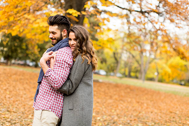 istock Young couple in the autumn park 509547648