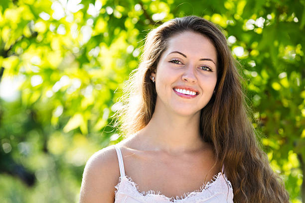 istock Smiling girl in summer park 509550644