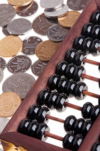 istock Old wooden Chinese Abacus and Chinese coins 509551608
