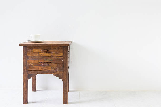 istock brown wood table in white room 509551672