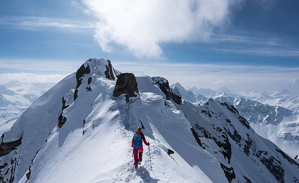 Ski mountaineering at the Flüela Schwarzhorn The Flüela Wisshorn, 3085m, can be reached in the winter by ski. The skis though need to be left about 150 m below the peak, to which one needs to climb up with crampons. It offers a lovely view over the region of the Kanton Graubünden. graubunden canton stock pictures, royalty-free photos & images