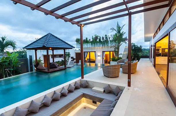A tropical modern villa exterior view with built in sofa