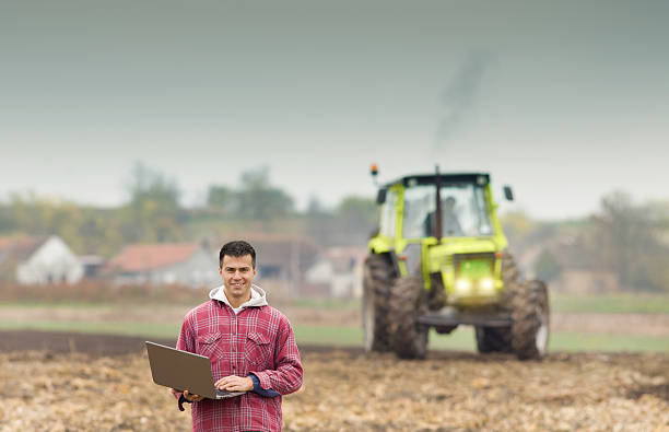 istock Farmer with laptop in the field 509553952