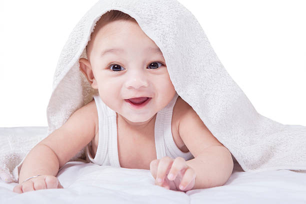 istock Joyful Baby Lying under A Towel 509554424