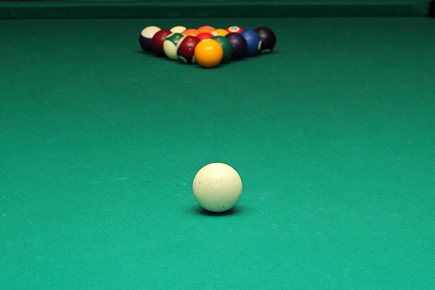 istock Billiard balls on green table and white ball 509556202