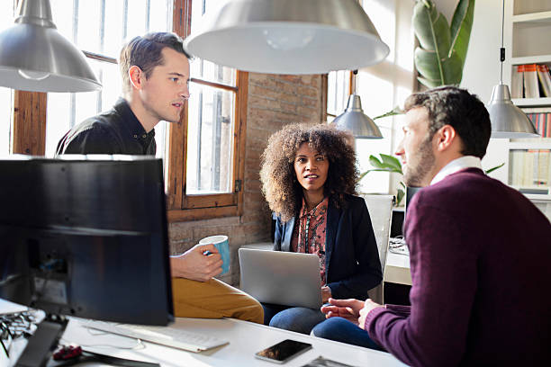 istock Creative business people having a casual discussion in the office 509556404