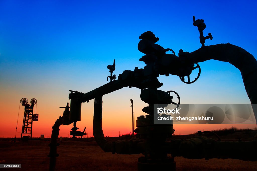In the evening of oilfield pipeline silhouette Pipeline Stock Photo