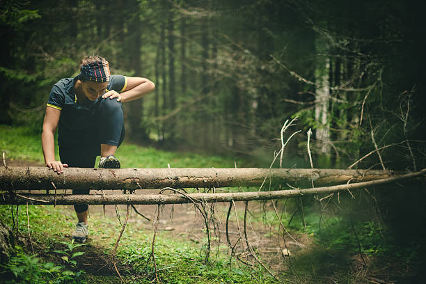 istock Woman athlete stretching in the forest after running 509557214