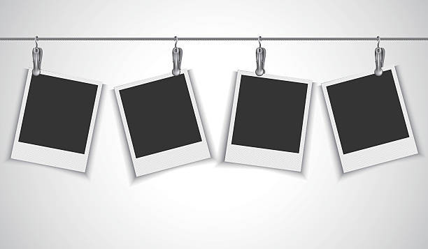 Blank photo frame hanging on wire rope with clip Vector EPS 10 format. hanging photos stock illustrations