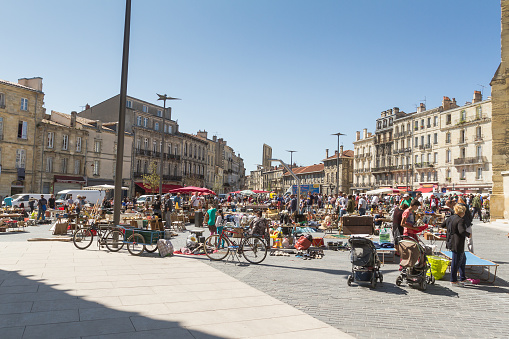 Bordeaux,  France - August 25, 2015: Little market of used stuff in Place Meynard near Saint Michael basilica - many people selling their old objects every sunday morning.