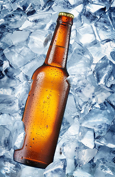 istock Cold bottle of beer in the ice cubes. 509558154