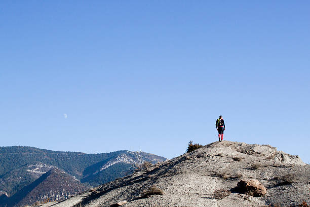 istock Mountaineer walking in the mountain and the moon 509558520
