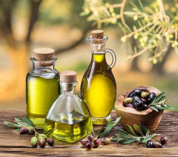 istock Olive oil and berries are on the wooden table. 509558990