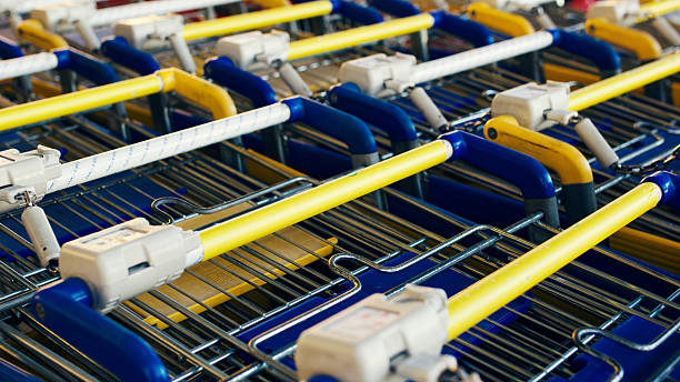istock Rows of yellow and blue shopping carts 509560550