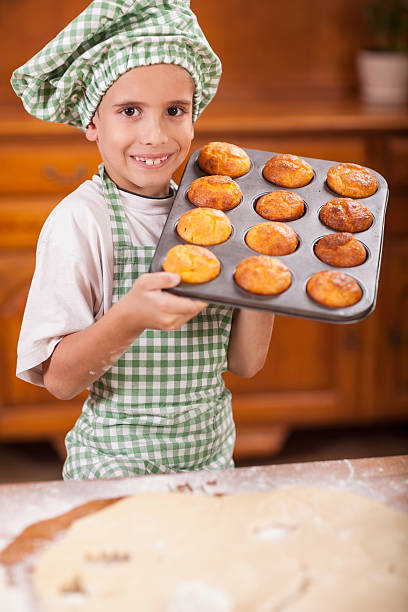 istock young boy chief  showing his made corn bread 509561360