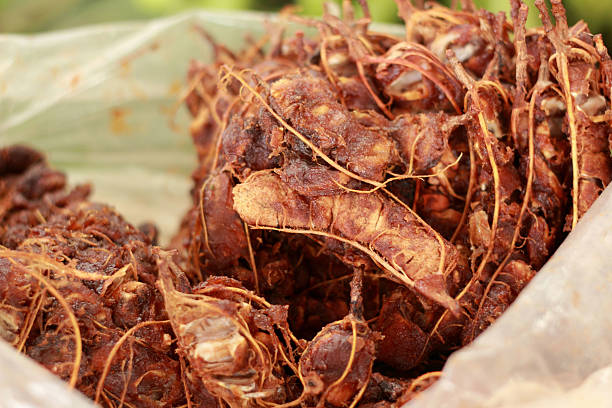 Background ripe tamarind fruit peeled.