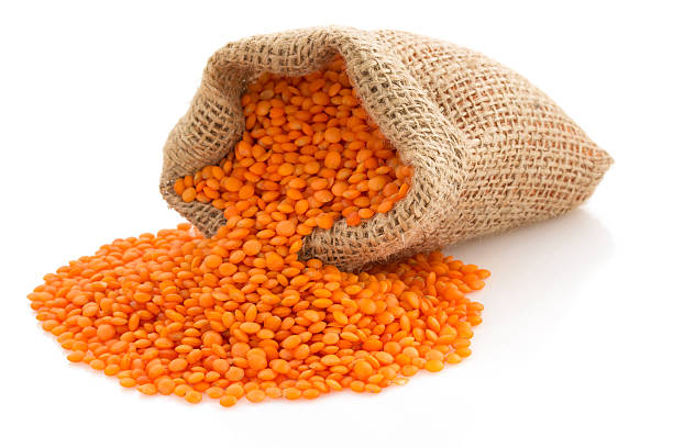 istock lentil in sack bag on white 509562921