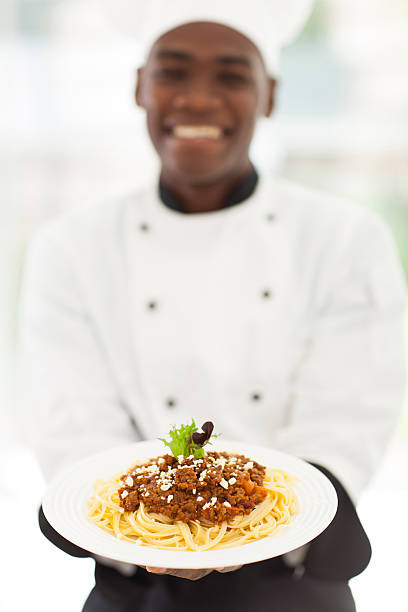 istock african male chef presenting spaghetti 509567339