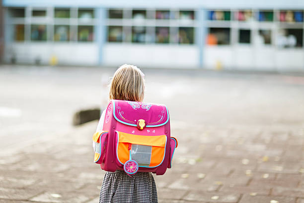 istock schoolgirl at school yard 509568561