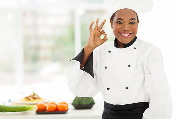 istock young african chef giving ok sign in hotel kitchen 509583187