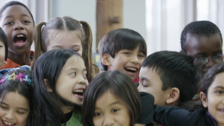 Happy ethnic group of diverse third graders