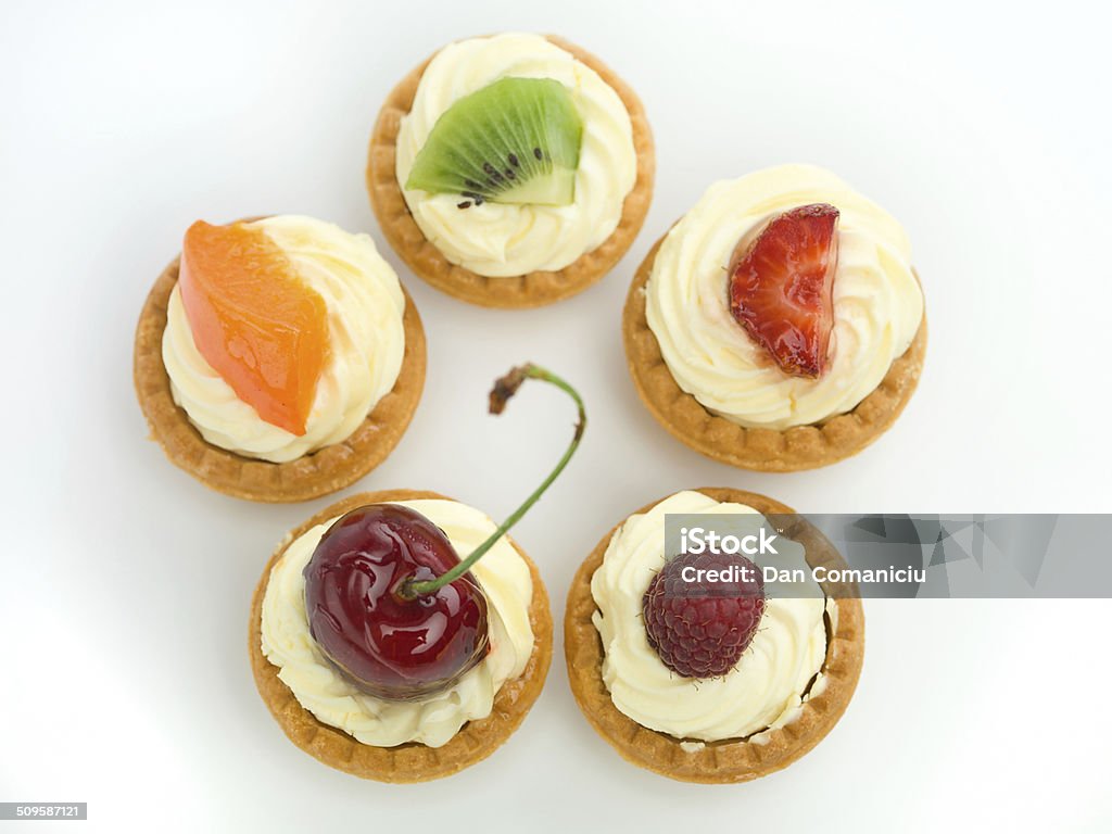 delicious tart circle delicious tart arranged in circle with raspberry cherries kiwi strawberry apricot white background izolated Fruit Stock Photo