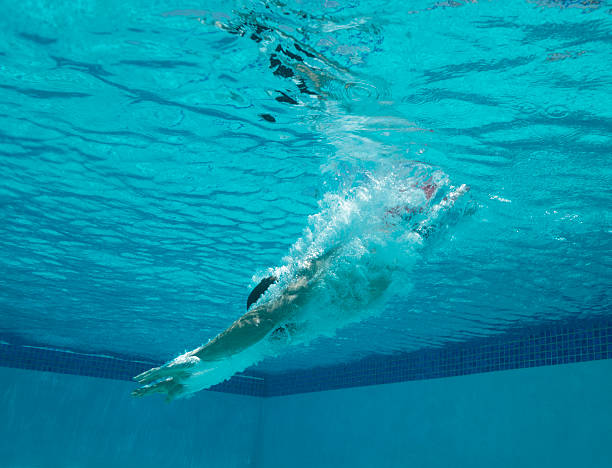 istock Young Man Diving Into A Swimming Pool 509587125
