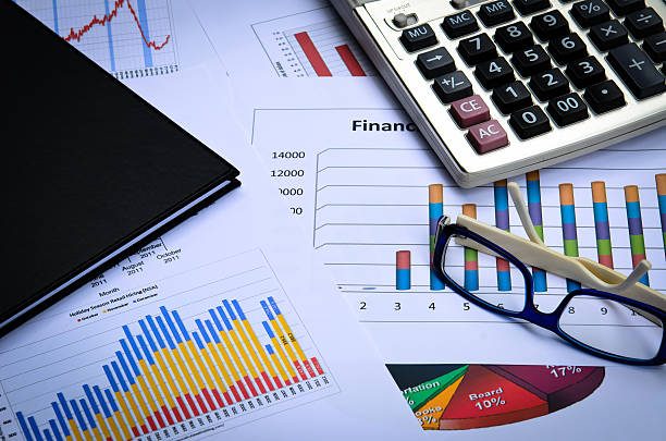 istock business charts and graphs with eye glass and book note 509588759
