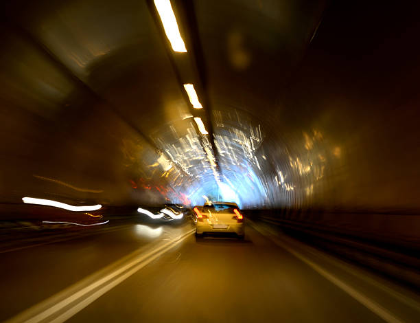 istock Tunnel with lights and moving cars 509589233