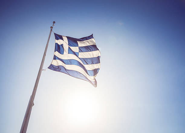 istock Real Greece Flag and Sky Nobody 509589785