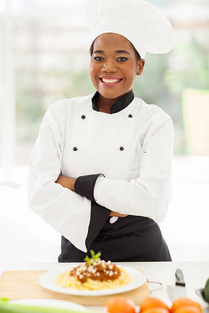 istock female african chef with arms crossed 509608523