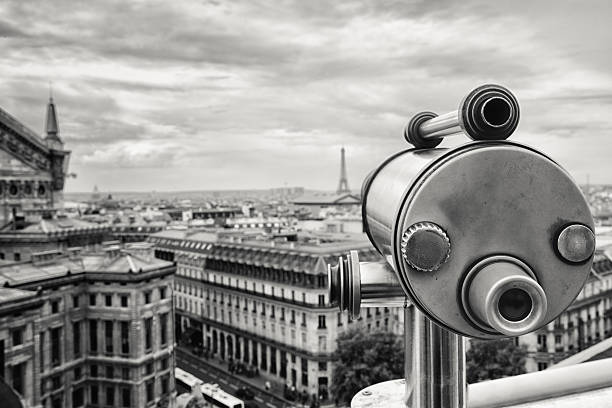 Distant view of the Eiffel Tower with coin op telescope in the foreground