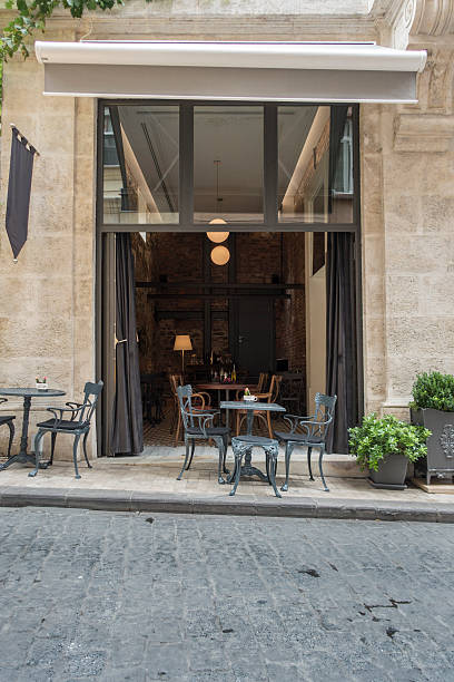 istock coffee shop entrance with tables on front 509610765
