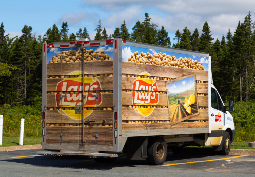 Nova Scotia, Canada - August 23, 2014: A Lay's delivery truck parked outside during the day. Lays provide snacks to the fast food industry.