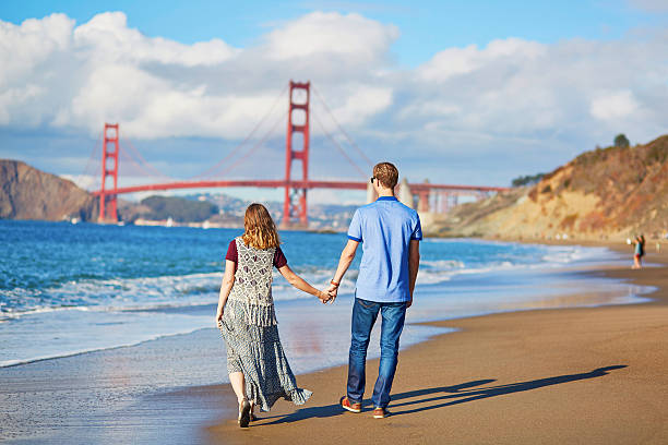 istock Romantic loving couple on Baker beach in San Francisco 509611394