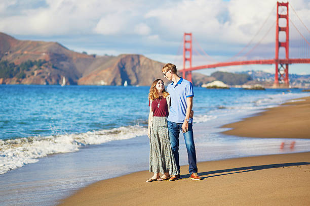 istock Romantic loving couple on Baker beach in San Francisco 509611560