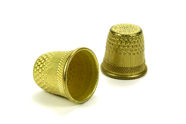 istock Old brass thimbles for sewing on a white background 509611722