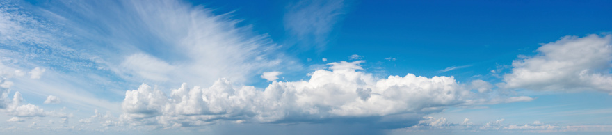 Panorama of nice cloud formations in a blue sky