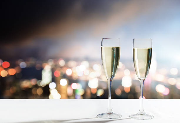 istock champagne Glasses and night city 509612127