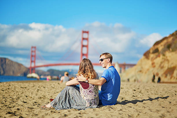 istock Romantic loving couple on Baker beach in San Francisco 509612332