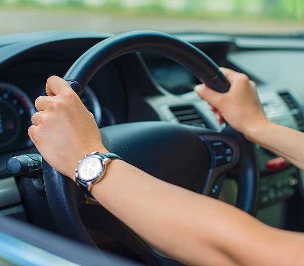istock Woman's hand driving a car. Unrecognizable person. 509612449