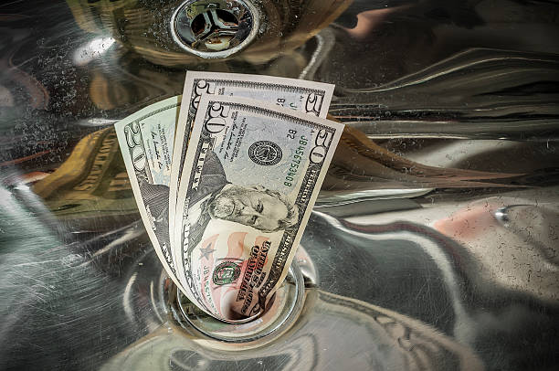 istock Money Down the Drain 509613218
