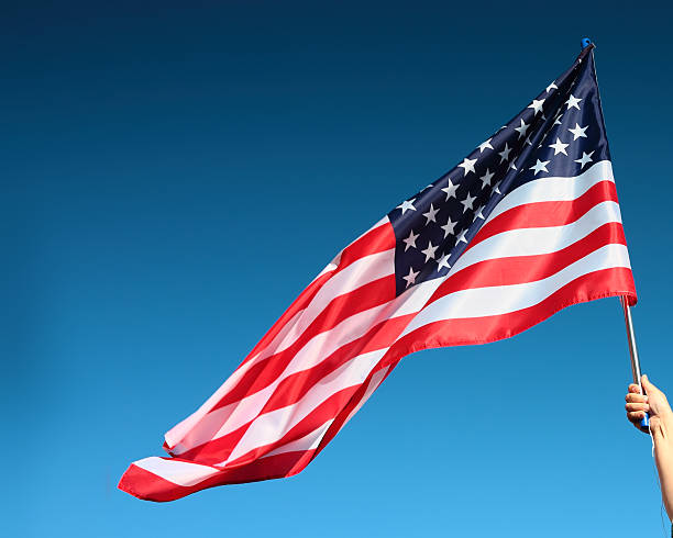 istock Hand holding american flag 509614443