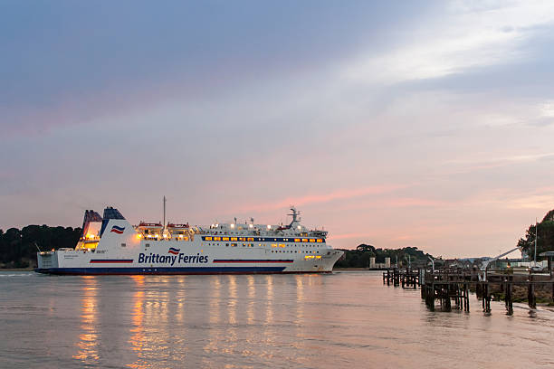 Ferry Poole, England - July 17, 2014: Brittany Ferries`s ship. Ferry arrive from France to Poole harbour in England. By the ferry is the Brownsea Island and the Brownsea castle. sandbanks poole harbour stock pictures, royalty-free photos & images