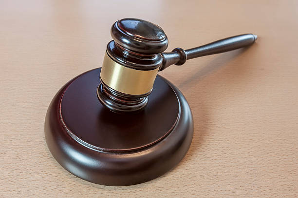 istock Wooden judges gavel on table 509615678